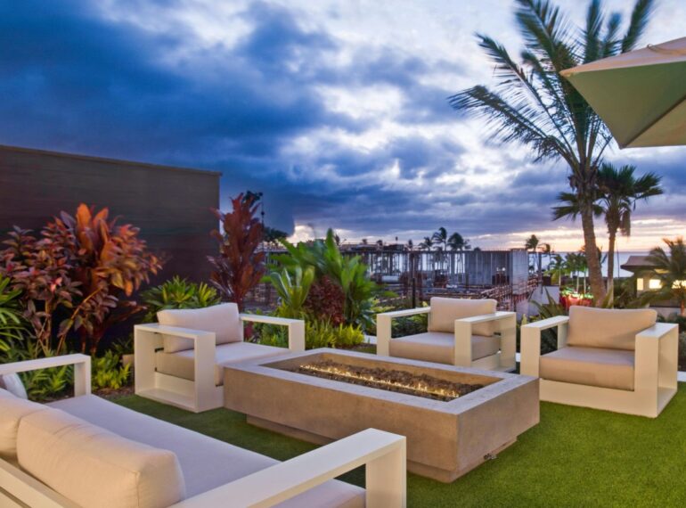 Luxury outdoor seating with modern sofas and firepit by Resort Furniture Manufacturer in Delhi with Get Furniture excellence in outdoor resort design.