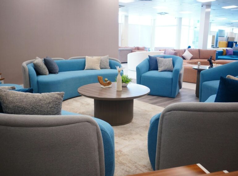 Modern blue and grey restaurant dining sofas in a spacious interior by Get Furniture, a leading Restaurant Dining Sofas Manufacturer Delhi