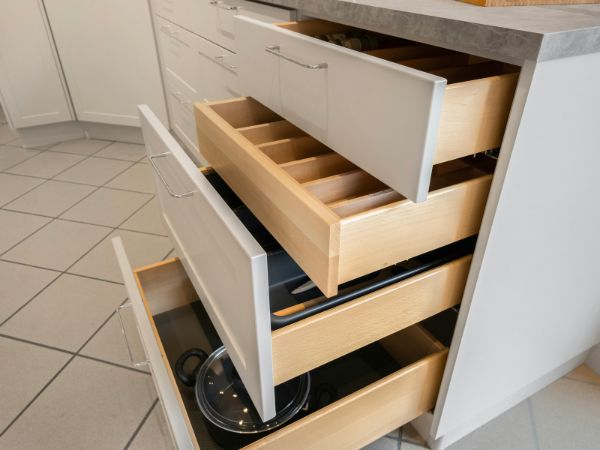 Minimalist kitchen setup with shelves and cabinets by kitchen furniture manufacturer India with Get Furniture Excellence.